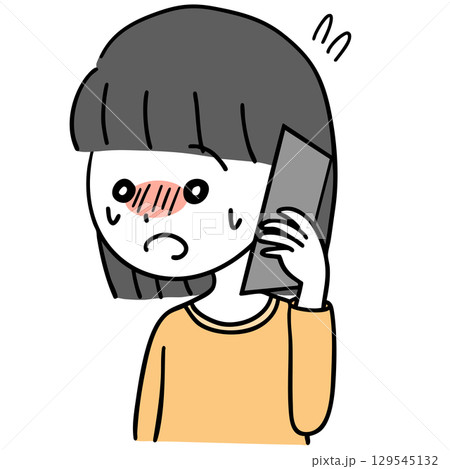 緊張しながら電話する女の子 129545132