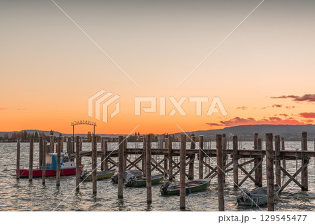 Sunset over a wooden jetty in Allensbach, Lake Constance, Germany 129545477