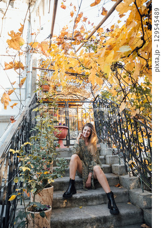 woman in autumn clothes smiling woman in autumn clothes smiling 129545489