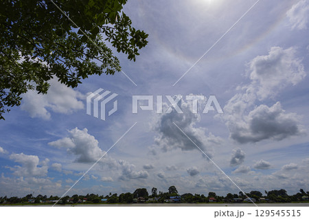The Bright Sky After The Rain. Taken on a bright, clear day in Chai Nat Province, this image features the river's gentle flow. Perfect for travel promotions 129545515