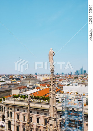 lone statue above Milan seen from the Duomo 129545564