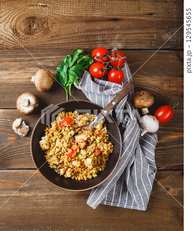 Couscous with turkey, tomatoes, champignon mushrooms and avocado. Couscous with turkey, tomatoes, champignon mushrooms and avocado. 129545655