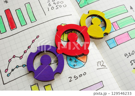 Teamwork and business growth concept. Connected figures with charts. Teamwork and business growth concept. Connected figures with charts. 129546233