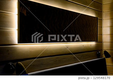 Hotel room with wooden interior, bed and night light Hotel room with wooden interior, bed and night light 129548170