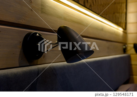 lamp light in bedroom. The low key image of night lamp. lamp light in bedroom. The low key image of night lamp. 129548171