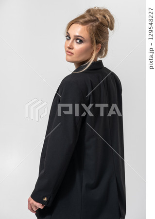 Beautiful woman with black suit studio portrait portrait on white background Beautiful woman with black suit studio portrait portrait on white background 129548227