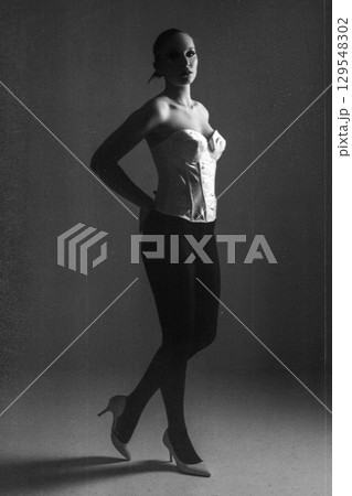 Beautiful dark woman portrait full body silhouette in grunge retro vintage style 129548302