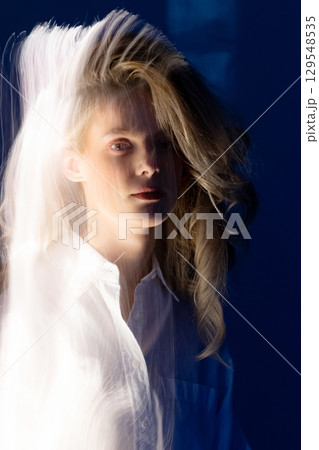Abstract woman studio portrait with light painting technique 129548535