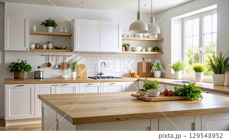 A kitchen with a wooden countertop and a large window. The kitchen is well-lit and has a clean, modern look. There are several potted plants throughout the space, adding a touch of greenery A kitchen with a wooden countertop and a large window. The kitchen is well-lit and has a clean, modern look. There are several potted plants throughout the space, adding a touch of greenery 129548952