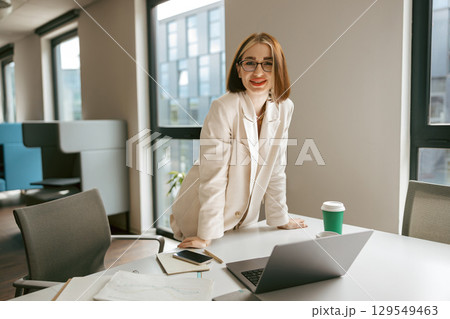 A Confident Professional in a Modern Office Setting, embodying creativity and inspiration A Confident Professional in a Modern Office Setting, embodying creativity and inspiration 129549463