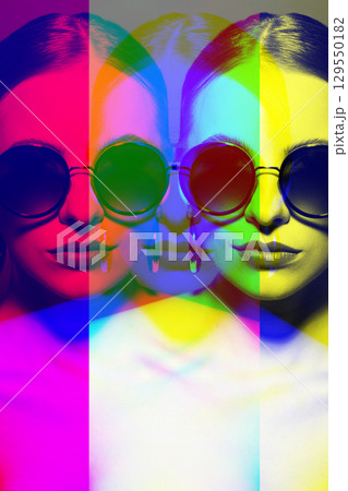 Woman portrait with classic hairstyle, big retro round sunglasses and earrings in RGB color split effect style 129550182