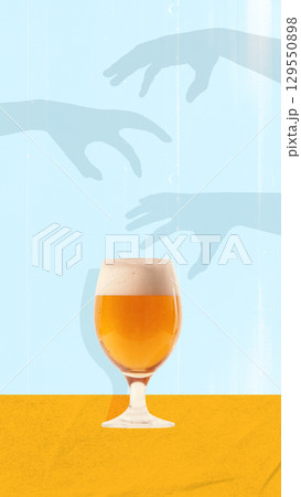 Colorful poster. Glass of golden beer with frothy head on yellow surface against blue background with reaching hands shadows Colorful poster. Glass of golden beer with frothy head on yellow surface against blue background with reaching hands shadows 129550898