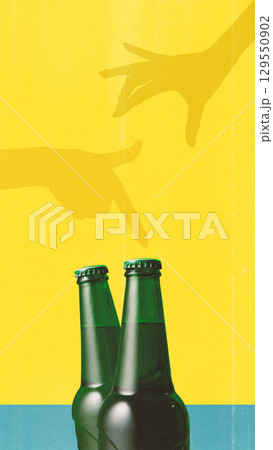Contemporary collage. Two green beer bottles on yellow and blue background with playful shadow hands above 129550902