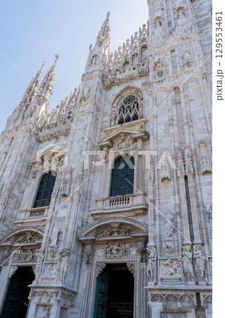 Church Milan Cathedral Duomo di Milano. Gothic architecture tourist attraction on piazza in Milan Lombardia Italy 129553461