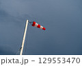 Windsock against rainy sky before thunderstorm 129553470