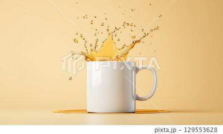 White Mug with Splashing Golden Liquid on a Yellow Background. 129553628