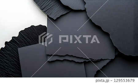 A minimalist contemporary abstract composition featuring overlapping geometric shapes in shades of black grey and white creating a visually striking pattern and textural surface 129553679