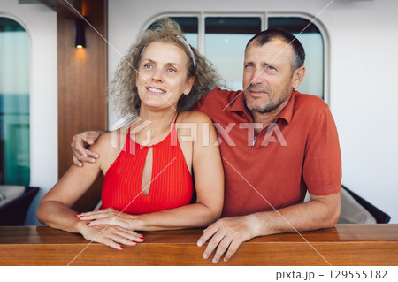 Couple in love on cruise ship. Man and woman in love enjoying their romantic vacation. High quality photo 129555182