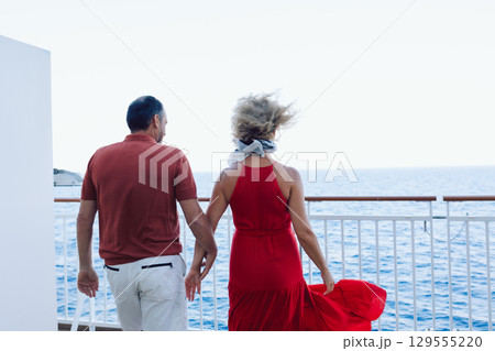 Married couple on cruise ship. Attractive couple on deck with cruise ship. High quality photo Married couple on cruise ship. Attractive couple on deck with cruise ship. High quality photo 129555220