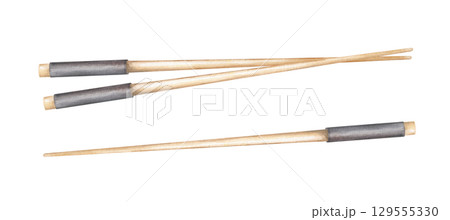 Traditional Asian wooden chopsticks watercolor illustration on isolated background. Top view. Bamboo chopstick with black holder for eating of sushi, ramen, noodle, rice. For restaurant menu, cookbook 129555330