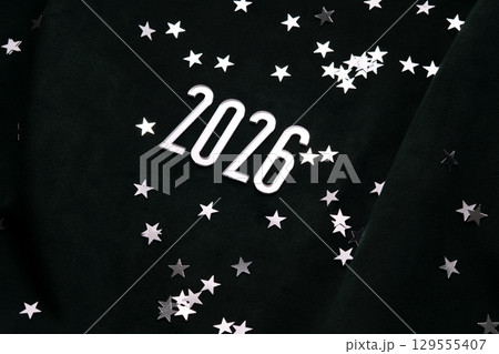 New Year 2026 dark background. Number of the coming year in Christmas decoration. New Year 2026 dark background. Number of the coming year in Christmas decoration. 129555407