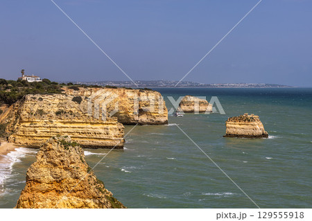 Praia da Marinha Beach among rock islets and cliffs seen from Seven Hanging Valleys Trail, Algarve, Portugal 129555918
