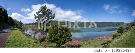 Panoramic view in spring of the Furnas crater lake and beautiful vegetation Panoramic view in spring of the Furnas crater lake and beautiful vegetation 129556457