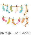 Socks on a rope with colored clothespins 129556580
