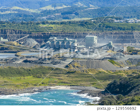 A large industrial quarry on the South Pacific Ocean coastline 129556692