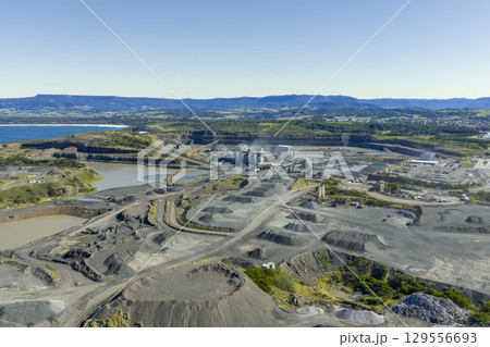 A large industrial quarry on the South Pacific Ocean coastline 129556693