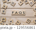 Wooden board with a crossword puzzle of letters 129556861