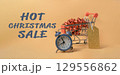 Shopping cart with a clock and a gold tag on it 129556862