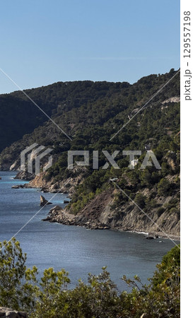 Rocky cove in Ibiza in Mediterranean 129557198