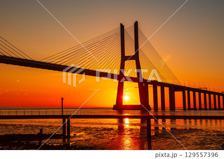 Vasco da Gamma road bridge in Portuguese capital Lisbon at sunrise. 129557396