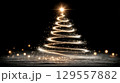 Glowing christmas tree spiral with festive lights and sparkling effects 129557882