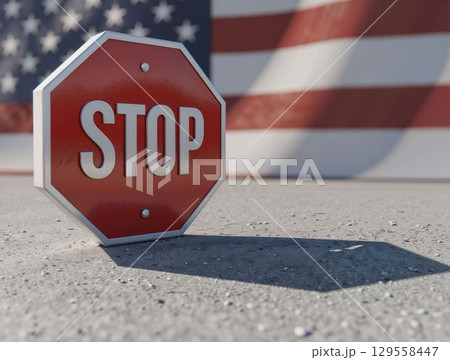 Stop sign in front of American flag, symbolizing national boundaries 129558447