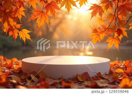 White podium surrounded by autumn leaves and a serene lake background. 129559046