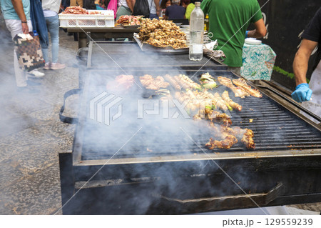 Street food, Meat on a barbecue grill Street food, Meat on a barbecue grill 129559239