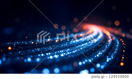 Vibrant light trails swirl in a mesmerizing display of colors during a digital art event at night 129559800