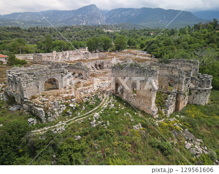 Tlos lower city basilica and stone arches among hills of Mugla, Turkey 129561606