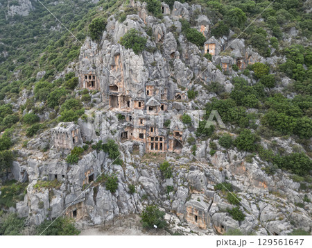 Aerial view of lycian rock cut tombs at Myra necropolis in Demre, Turkiye Aerial view of lycian rock cut tombs at Myra necropolis in Demre, Turkiye 129561647