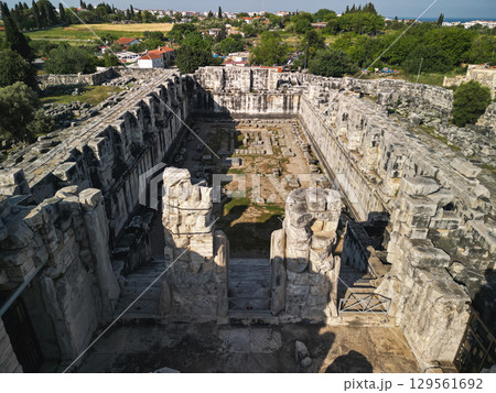 Aerial view into didyma apollo temple cella with towering marble walls, Turkey Aerial view into didyma apollo temple cella with towering marble walls, Turkey 129561692
