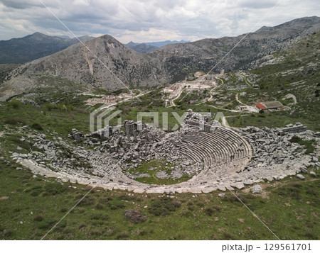 Aerial view of Sagalassos theater terraces amid alpine hills by Burdur, Turkiye 129561701
