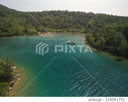 Yacht anchored in a calm turquoise inlet, Gocek Bay, Mugla Province, Turkey 129561752