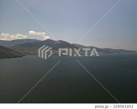 Wide expanse of bafa lake with distant hills and gentle ripples, aydin, Turkey Wide expanse of bafa lake with distant hills and gentle ripples, aydin, Turkey 129561852