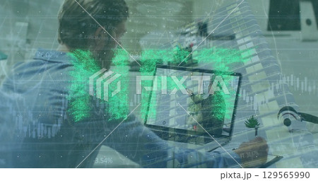 Image of nft over caucasian man having image call on laptop 129565990