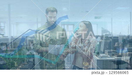 Image of financial data processing and cityscape over diverse business people 129566065