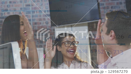 Image of data processing over diverse business people high fiving 129567270