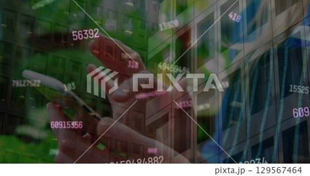 Image of data processing over caucasian woman using smartphone 129567464