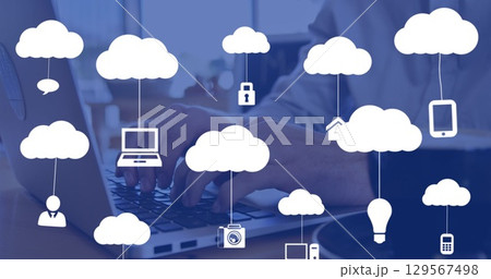 Image of clouds with icons over hands using laptop Image of clouds with icons over hands using laptop 129567498